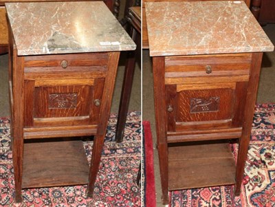 Lot 1308 - A pair of oak marble topped pot cupboards