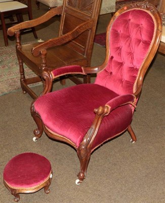 Lot 1313 - A Victorian carved mahogany framed button back open armchair and footstool upholstered in...