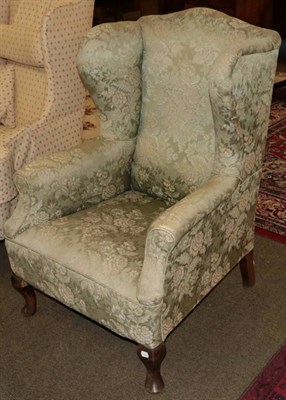 Lot 1327 - A George III style wing chair