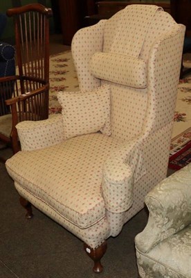 Lot 1328 - A Georgian style wingback chair