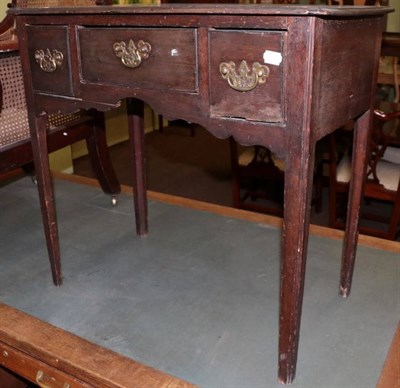 Lot 1338 - An 18th century provincial oak lowboy