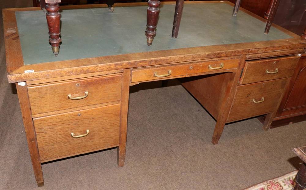 Lot 1339 - An early 20th century oak desk