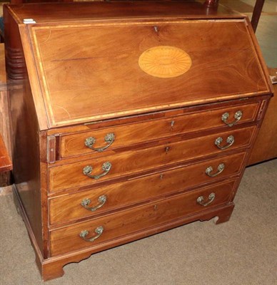 Lot 1341 - A George III satinwood crossbanded mahogany bureau