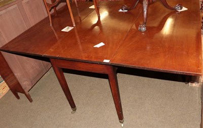 Lot 1342 - A large George III mahogany drop leaf table, 164cm wide