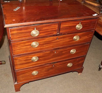 Lot 1346 - A George III mahogany straight fronted chest of drawers, two short over three long drawers