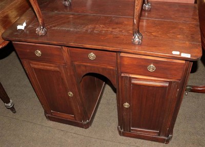 Lot 1349 - A stained pine kneehole desk