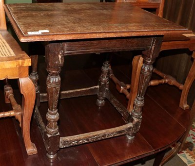 Lot 1351 - A 17th century oak occasional table with later top