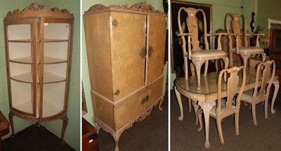 Lot 1354 - An Epstein bleached walnut eleven piece dining room suite comprising a dining table on carved...