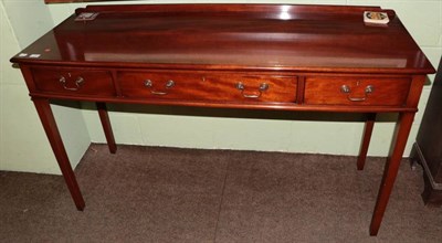 Lot 1363 - A reproduction three drawer serving table