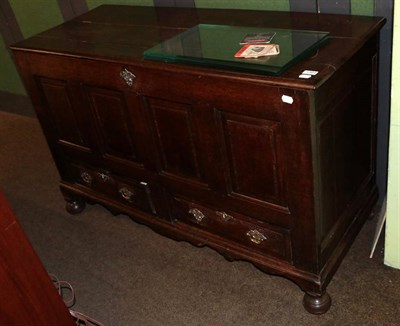 Lot 1364 - A Georgian oak mule chest