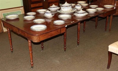 Lot 1371 - A George III mahogany extending dining table, circa 1820 with two extra leaves