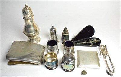 Lot 1 - A silver cigarette case; a sugar caster; a compact; a spoon and locket; together with a small...