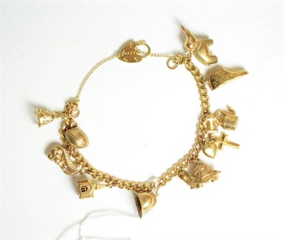 Lot 21 - A 9 carat gold charm bracelet, hung with ten charms including an elephant, a rugby ball, a...