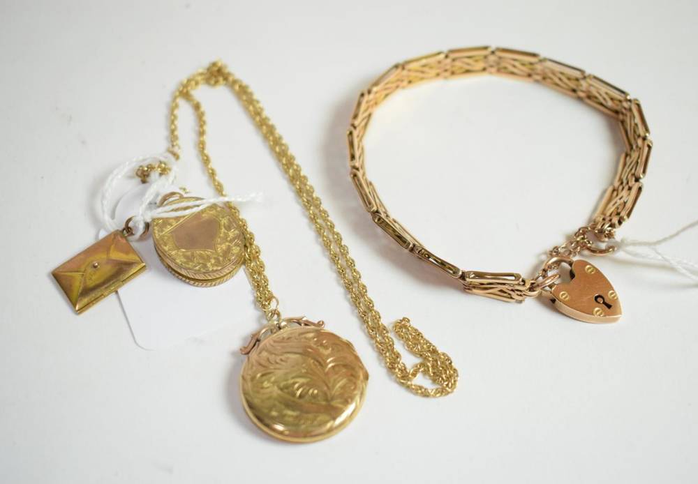 Lot 23 - A fancy link bracelet with clasp stamped 375; a locket stamped inside 375 with an attached...