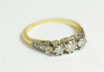 Lot 42 - An 18 carat gold diamond three stone ring, finger size L