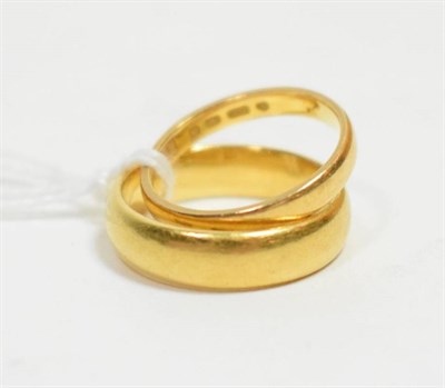 Lot 50 - Two 22 carat gold band rings, finger size K and N1/2 (2)