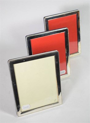 Lot 61 - Three large modern silver photograph frames with rope edge border,  23cm high (3)