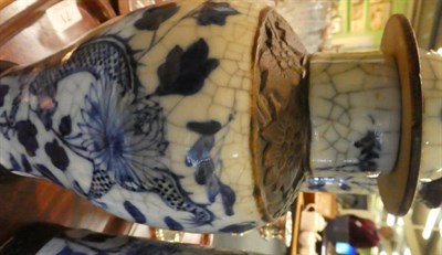 Lot 71 - A garniture of three Chinese blue and white porcelain vases, decorated with dragons