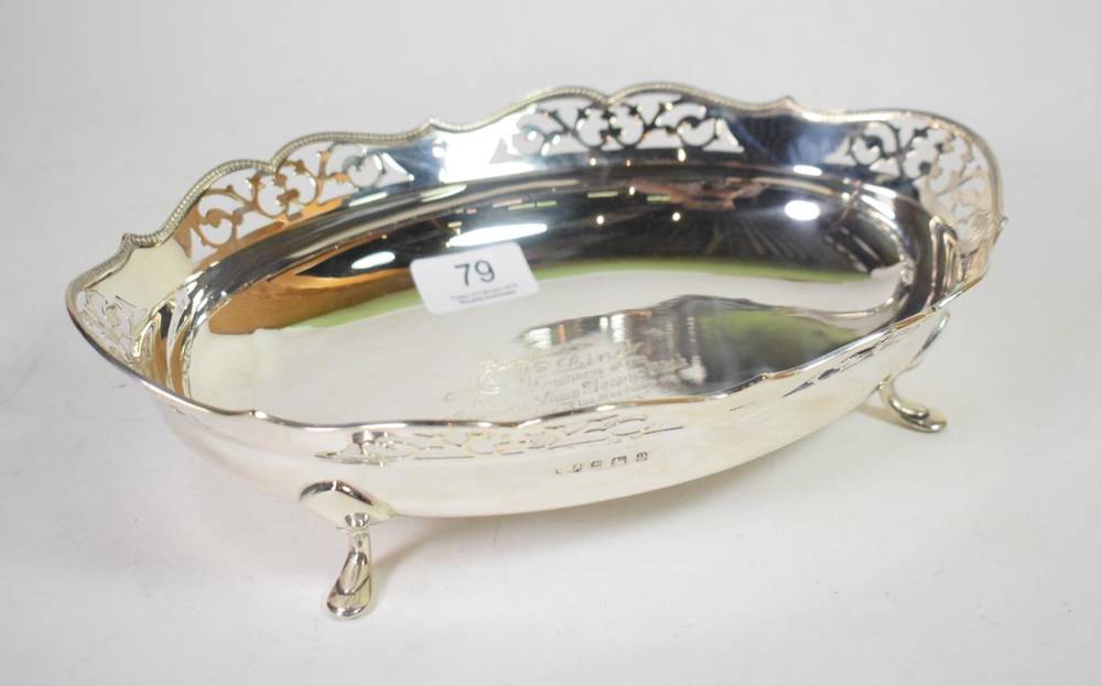 Lot 79 - An oval silver basket, maker indistinct, Birmingham 1932, with shaped and pierced rim, on four...