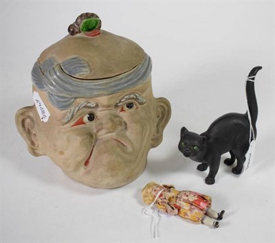 Lot 107 - A Wedgwood black basalt cat, with glass eyes; together with a grotesque tobacco jar and a miniature