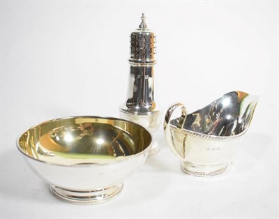 Lot 119 - An Edwardian silver sauce boat, Martin & Hall, Sheffield 1907, with gadroon borders; a silver bowl