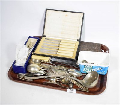 Lot 139 - A quantity of silver to include assorted spoons; napkin rings; silver handled knives; and a...