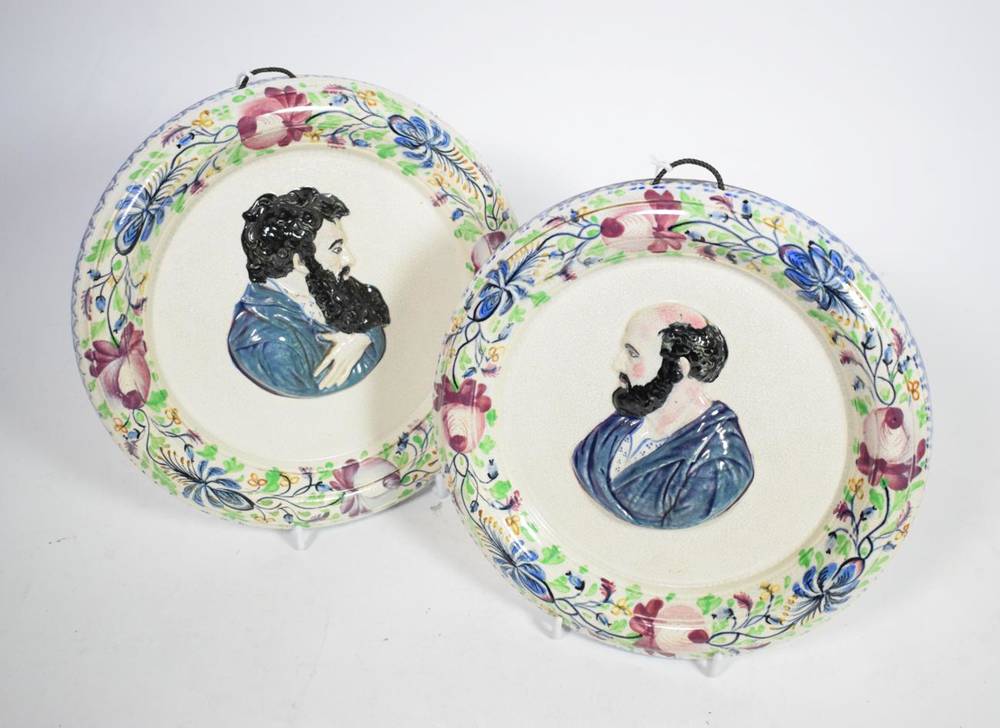 Lot 150 - A pair of Portobello pottery wall plaques, circa 1820, moulded in relief and painted with bust...
