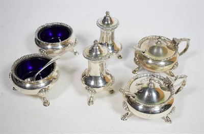 Lot 155 - A six piece silver condiment set, Walker & Hall, London 1960, with straight gadroon border on...