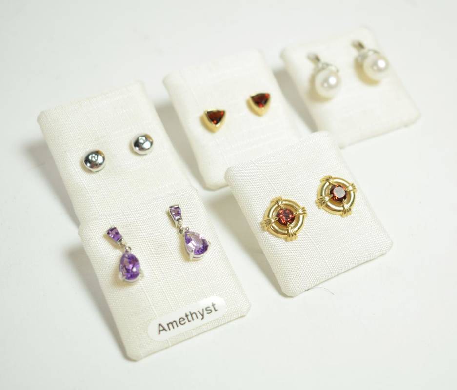 Lot 212 - A pair of 18 carat white gold diamond stud earrings; a pair of 9 carat white gold cultured...
