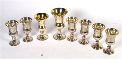 Lot 230 - A set of six late Victorian Continental silver Kiddish cups, English import marks for Solomon...