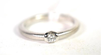 Lot 234 - A platinum solitaire diamond ring, a round brilliant cut diamond in a tension setting, to a...