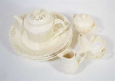 Lot 247 - Ten items of Creamware: a teapot; a milk jug; two sucriers and covers; three large plates