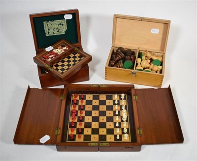 Lot 248 - A stained bone chess set within a box bearing old Staunton paper label; a turned wooden...