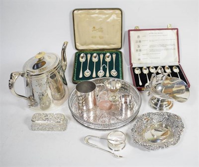 Lot 269 - A group of silver items comprising: two sets of coffee spoons, in fitted cases; a pierced dish;...