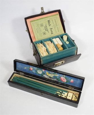 Lot 271 - A cased Mahjong set and a Japanned fan box containing a set of bone dominoes