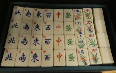 Lot 271 - A cased Mahjong set and a Japanned fan box containing a set of bone dominoes