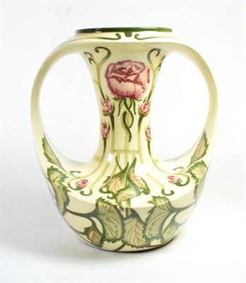 Lot 278 - A Cobridge pottery twin-handled vase decorated by Kerry Goodwin in the Florian rose style...