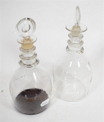 Lot 284 - A pair of 19th century triple ring neck decanters with reeded decoration