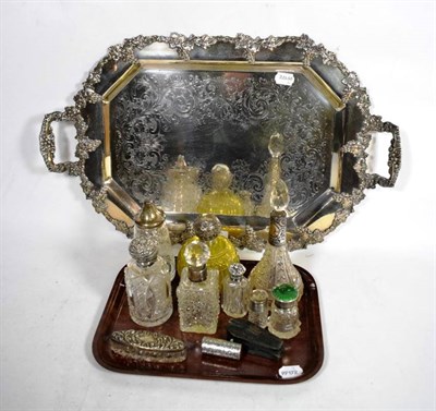 Lot 289 - A small collection of silver topped cut glass scent bottles; a Victorian silver scent bottle; a...