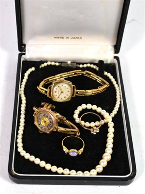Lot 320 - A ladies 9 carat gold wristwatch; another ladies 9 carat gold wristwatch; two dress rings and a...
