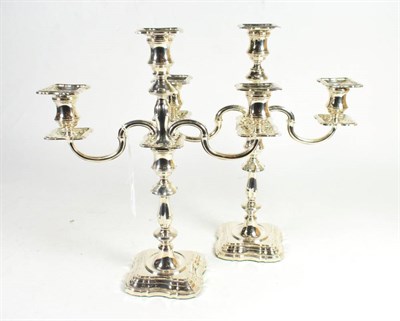 Lot 345 - A pair of silver three light candelabra of 18th century style, C J Vander, Sheffield 1999, with...