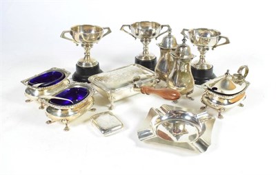 Lot 354 - A small group of silver comprising a five piece condiment set; three small trophy cups; a vesta...