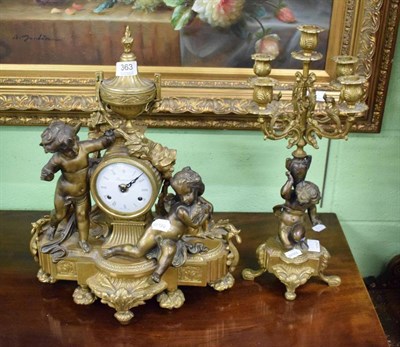 Lot 363 - A bronze and gilt bronze Continental figural mantle clock, with an urn surmount above a pair of...