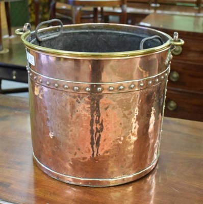 Lot 365 - A 19th century copper coal bucket with brass handle and a brass coopered oak pail