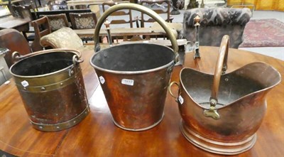 Lot 1033 - A 19th century copper and brass pail, a copper and brass studded pail and a copper helmet form coal
