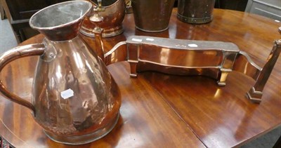 Lot 1034 - A 19th century copper harvest jug and a copper fire front radiator