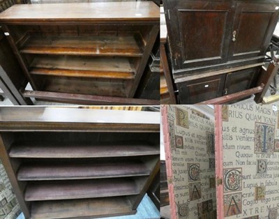 Lot 1163 - An open bookcase; a further open bookcase; a four-fold fabric screen; and a pair of two door...