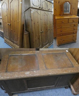 Lot 1167 - A pine triple wardrobe; a double wardrobe; a six-height chest of drawers and a toilet mirror;...