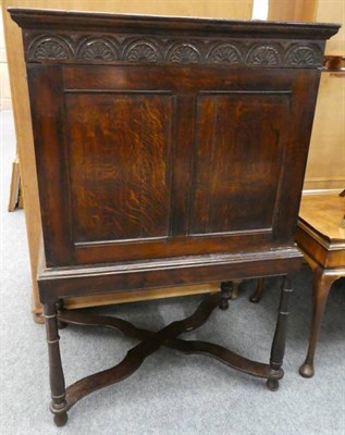 Lot 1171 - An early 19th century style lunette carved oak cabinet on stand (converted to a TV cabinet)