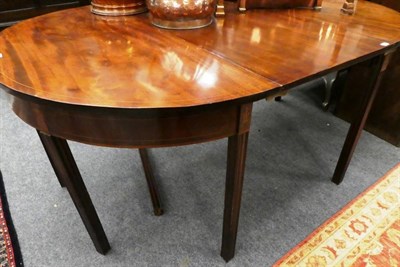 Lot 1173 - A George III mahogany, boxwood and ebony strung D shape dining table, with one additional leaf,...